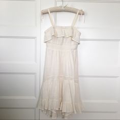 This Flowy, Cotton Dress Will Make You Feel Like Your On Vacation! It’s Light But Is Double-Lined And Great Quality. It’s Meant To Be Strapless, But I Did Sew Straps On. I Can Remove Them At Request. The Skirt Is High-Low:) -Never Worn, Great Condition - Measurements: Bust 29” Waist 25” Length 30 1/2” (Front); 35” (Back) Off-white Ruffled Midi Dress For Beach, Off White Ruffled Midi Dress For Beach, White Cotton Midi Dress With Ruffle Hem, Off White Ruffled Midi Dress For Daywear, Chic White Sundress With Ruffle Hem, Off White Sundress Midi Dress For Spring, Off White Midi Mini Dress For Summer, Chic Cream Sundress For Daytime, Off White Summer Midi Dress