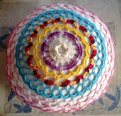 a crocheted doily is sitting on the floor