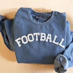 Cozy up with our Comfort Colors Football Crewneck Sweatshirt this fall season! The perfect gift to all football lovers our there! - Our sweatshirt material is super soft and high quality! ♡ - Garment-Dyed Sweatshirt (Sustainable style)  - 80% cotton, 20% polyester - All our sweatshirts run a UNISEX fit. (Both for men and women) They fit true to size. But if you like a more baggy look, we highly recommend sizing up. - These letters are embroidered iron-on patches that have been heat pressed, not Football Merch, Beach Dessert, Game Day Sweatshirt, Wrap Shoes, Football Sweatshirt, Pullover Cardigan, Cool Graphic Tees, Active Wear Pants, Football Mom