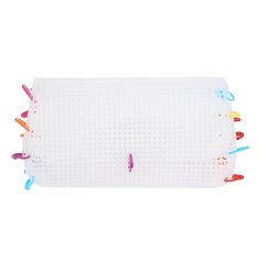 an image of a white mat with colorful toothbrushes on it's sides