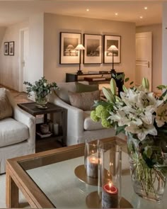 a living room filled with furniture and flowers