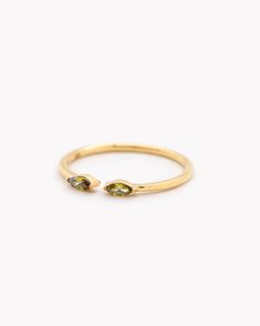 Add a modern touch to your look with this Cubic Zirconia ring in sterling silver featuring an open point design. Handcrafted in vermeil, a thick 18K gold layer on solid 925 sterling silver. ___________________________________ D E T A I L S : ▪ 18K Gold Vermeil Ring▪ Base Metal - Solid 925 Sterling Silver▪ Gemstone - Cubic Zirconia ▪ Hypoallergenic▪ Shipped from Berlin▪ Orders to the US - No Customs Fees Upon the Delivery___________________________________ M A T E R I A L S : ～18k gold vermeil. D Modern Gold Open Birthstone Ring, Modern Gold Marquise Ring, Point Design, Gold Vermeil Jewelry, Vermeil Jewelry, Cubic Zirconia Rings, Solid Metal, Base Metal, Solid 925 Sterling Silver