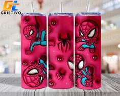 two pink tumblers with spiderman faces on them