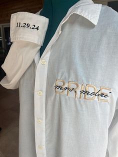 a white shirt with the word bride embroidered on it's chest and collarline