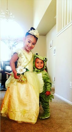 two children dressed up as frog and princess