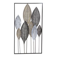 a metal sculpture with four different leaves on the top and one is black, white and gold