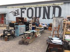 an outdoor flea market with lots of items for sale