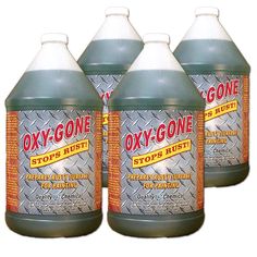 three bottles of oxy - gone rust removeer sitting next to each other