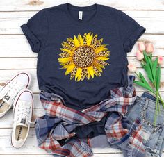 "Leopard Sunflower, Summer Shirt, Womens Graphic shirt, Flower Shirt, Retro Shirt, Sunflower shirt, Birthday Gift, Leopard print, Wife gift Unisex T Shirt is made of super soft lightweight cotton T-shirt is made of Pre-shrunk 100% ultra soft cotton, runs true to size, unisex standard fit shirt » Deep Heather is 52/48 combed and ringspun cotton/polyester, » Sport grey and Black Heather are 90/10 combed and ringspun cotton/polyester » Prism Colors: 99% combed and ring-spun cotton, 1% polyester » l Spring Shirt With Funny Print As A Gift, Spring Funny Print Shirt As A Gift, Spring Funny Print Shirt As Gift, Funny Print Shirt As A Spring Gift, Spring Shirt With Funny Print For Gifts, Spring Gift Shirt With Custom Print, Funny Print Shirt For Summer Gift, Summer Funny Print Shirt For Gift, Cute Summer Shirt As A Gift