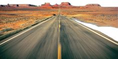 an image of a road going through the desert