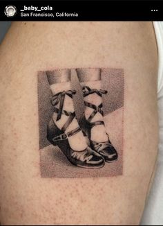 a black and white photo of a woman's legs with high heels on it