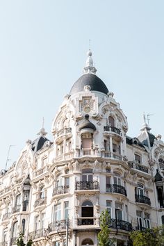 an ornate building with many balconies on top