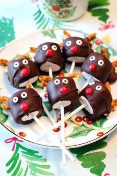 chocolate covered candies with eyes and noses are on a plate, ready to be eaten