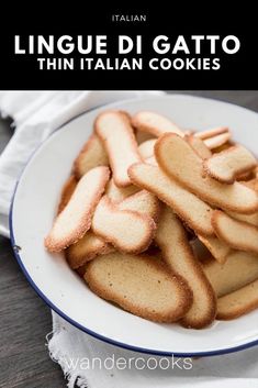 a white plate topped with cookies on top of a wooden table