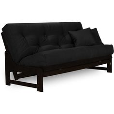 a black futon sofa with two pillows on the back and one arm folded down