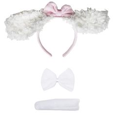 a white headband with a pink bow on top and two bows at the bottom