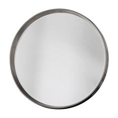 a round metal mirror on a white background