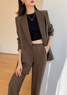 Elevate your wardrobe with the Julia Brown Plaid Blazer Wide Leg Pantsuit Set. This two-piece set exudes sophistication and refinement with its wide-leg pants and plaid blazer. Perfect for any occasion, this set will add a touch of elegance to your look. Embrace your inner fashionista with this statement piece. Notched lapels Long sleeve Double-breasted button closure Wide leg pants Polyester,Spandex Item #241173 Women's blazer & wide-leg pants set SIZE INFO XS=US2=UK6=EU32 S=US4-6=UK8-10=EU34-3 Brown Plaid Blazer, Julia Brown, Brown Plaid, Plaid Blazer, Two Piece Sets, Height And Weight, Polyester Spandex, Leg Pants, Wide Leg Pants