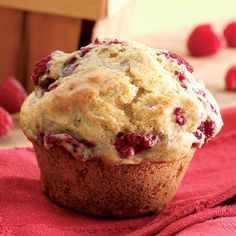 a muffin sitting on top of a red cloth