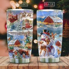 two christmas themed cups sitting on top of a wooden table