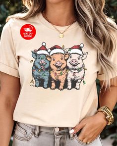 Merry Pigmas T-Shirt, Christmas Pig Shirt, Christmas Pig Shirt, Pig Lover Gift Shirt, Pig Owner Christmas Shirt, Women Christmas Shirt 🌟 Welcome to Custom Style Lab Art! 🌟 We're thrilled to have you here! Thank you for stepping into our store, where you'll discover carefully crafted, high-quality products. Our unique gift options are perfect for surprising your loved ones, friends, family, and colleagues. Each design is created to bring a smile to their faces! Why Choose Us? Our prints are produced using state-of-the-art DTF machines, ensuring bright colors and exceptional quality. Each order is crafted with premium materials to bring your vision to life. Every product you purchase is important to us--we want to accompany you in your most beautiful moments with our high-quality offerings Christmas Shirt Women, Lab Art, Pig Shirt, Pig Shirts, Pig Lovers, Women Christmas, Christmas Women, Beautiful Moments, Baby Bag