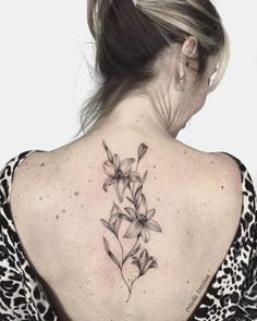 a woman with a tattoo on her back