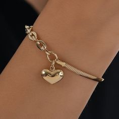 "\"14k Gold Puffed Heart Charm Bracelet | Herringbone Flat Snake Chain and Thick Cable Link Paperclip Chain w/ Lobster Claw | Gift for Her\" * Material: 14k Solid Gold * Weight: 6,54gram -%10 due to size) Contact me if you are unsure about length. Extension links are standard for minor adjustments. ∙ P R O D U C T I O N ∙ * All of my products are handmade and crafted with care and love:) * All of my products are SOLID GOLD, no gold fill, no gold coating. Also there are no other metals used so al Gold Chain Bracelet With Charms For Valentine's Day, Gold Chain Charm Bracelet For Valentine's Day, Valentine's Day Gold Chain Charm Bracelet, Valentine's Day Heart-shaped Chain Charm Bracelet, Valentine's Day Heart Charm Bracelet With Chain, Gold Heart Charm Bracelet With Chain, Heart Shaped Gold Plated Charm Bracelet, Gold Heart Bracelet With Lobster Clasp, Valentine's Day Heart-shaped Chain Bracelet With Lobster Clasp