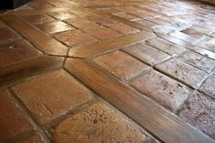 an image of a floor that is made out of bricks