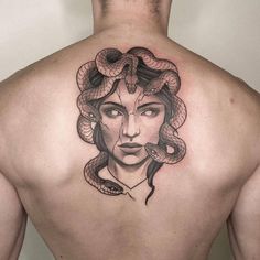 a woman with a snake on her back