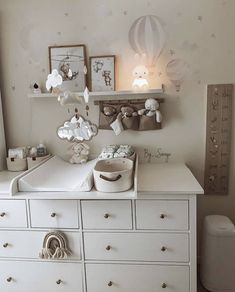 a white dresser topped with lots of drawers