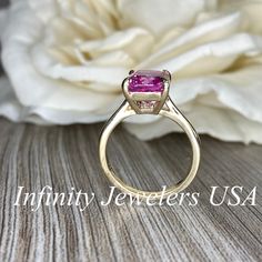 "The ring pictured is lab created sapphire #6419 Video shown in 14k white gold -Approximate total carat weight: 3.90ctw. diamond equivalent -Center Stone Size: approx. 3.90ct diamond equivalent -Center Stone Shape: radiant cut 10x8 mm -Gem Type: lab created pink sapphire -Stone Clarity: VS2 -Stone Color: pink -Moh's Scale: 9 hardness -Metal Type and Purity: 14k yellow gold -Setting: Claw Prong Brasket Head -Stock Ring Size: 6 -Country of Manufacturing: USA (Michigan) For customization please con Gia Certified Classic Pink Sapphire Jewelry, Classic Gia Certified Pink Sapphire Jewelry, Fine Jewelry 14k Gold Gia Certified Sapphire Ring, Gia Certified 14k Gold Sapphire Ring, Gia Certified Yellow Gold Sapphire Promise Ring, Pink Sapphire Emerald Cut Ring For Anniversary, Emerald Cut Pink Sapphire Ring For Anniversary, Pink Sapphire Ring With Center Stone For Anniversary, Gia Certified Round Cut Pink Sapphire Ring