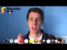 a young man is holding up his fingers to show the different balls in front of him