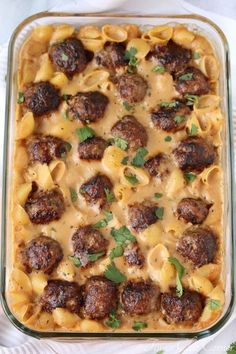 a casserole dish filled with meatballs and pasta