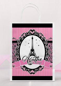 a pink and black shopping bag with the eiffel tower on it