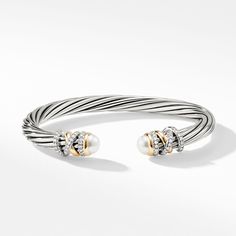 In the Helena Collection, David Yurman returns to the longer, leaner twist of his first handmade Cable bracelet, wrapping the iconic form with 18K yellow gold threads accented with hand-set pavé diamonds. Sterling silver with 18-karat yellow goldCultured freshwater pearls, 6.75-7mmPavé diamonds, 0.48 total carat weightBracelet, 6mm David Yurman Watch, Bracelet With Pearls, Yurman Bracelet, Petite Jewelry, Color Bracelet, Cable Bracelets, Elevated Style, Wishful Thinking, Elegant Bracelet