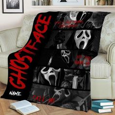 a couch with a blanket on top of it that says ghostface in red and black