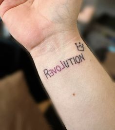 a woman's wrist tattoo with the word notulover written on it