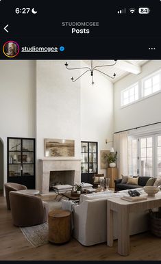 a living room filled with furniture and a fire place in the middle of an open floor plan