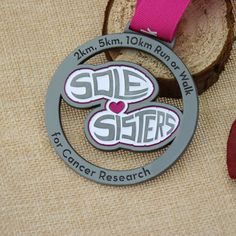 Sole Sisters run/walk Custom medals.These custom made medals are features with highly skillful cutouts craftwork, die cast, carved with Sole Sisters logo on the center,  which makes it more ourstanding. Award all the sisters with this custom medals for their excellent performances in the race. Congratulation. Sisters Logo, Race Medals, Sole Sisters, 5k Race, The Sisters