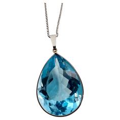 Modern and simple blue topaz pear shape pendant necklace, the pear topaz is large at 25 carats and 12x10mm size. Item will come with a box, certificate of authenticity. Metal: 14KT white gold Carat: 25ct total Center Stone: Certified Topaz Color: Blue Size: 12x10mm Clarity: Very Slightly Blemished Cut: Pear Certificate of authenticity comes with purchase ABOUT US We are a family-owned business. Our studio in located in the heart of Boca Raton at the International Jewelers Exchange. We have been Pear Shaped Pendant, Topaz Color, 14kt Gold, Pear Shape, Selling Online, Pear Shaped, Blue Topaz, Gold Chains, Topaz