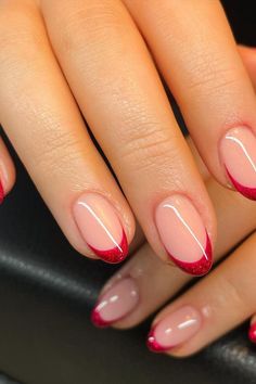 Embrace elegance with these almond-shaped nails featuring a sheer pink base. Each tip is meticulously outlined with a vibrant red glitter, adding a sparkling contrast that's playful yet sophisticated. Perfect for a touch of glamour any day.  // Photo Credit: Instagram @sophiemaelle_lashes_nails Red Shimmer French Tip Nails, Red French Nails With Glitter, Red Glitter French Tip Nails Square, Red Nail Designs French Tips, Red French Glitter Nails, New Years Nail Ideas Sparkle, Christmas Red Tip Nails, Red French Tip Nails With Glitter, French Nails Red Tips