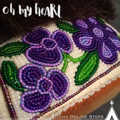 a close up of a bag with beads and flowers on the front, along with text that reads oh my heart