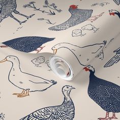 a white wallpaper with blue and red birds in the background, on top of it