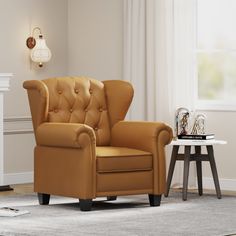 a tan leather chair sitting in front of a white fireplace with a clock on the wall