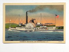 an old postcard depicting a steamboat on the water