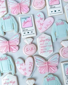 decorated cookies with pink and blue designs on them