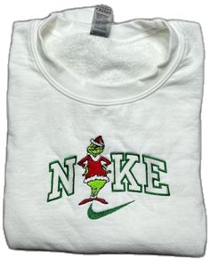 White Embroidered Sweatshirt For Winter, White Tops With Embroidered Logo For Christmas, Christmas Sweatshirts Nike, White Top With Embroidered Logo For Christmas, Nike Embroidery Christmas Sweatshirt, Grinch Nike Hoodie, Nike Grinch Sweatshirt, Half Sleeve Hoodie, Christmas Crewneck Sweatshirt Grinch