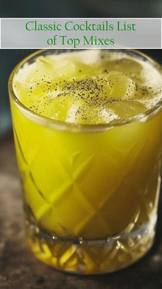 a close up of a drink in a glass on a table with the words classic cocktails list of top mixes