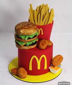 a cake made to look like a mcdonald's burger and fries