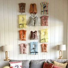 a living room filled with furniture and lots of pillows on top of the couches